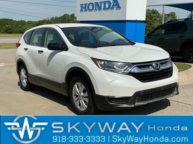 2019 Honda CR-V LX in Platinum White Pearl — front three-quarter view